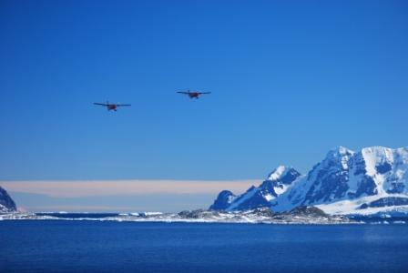 twin otters fly by